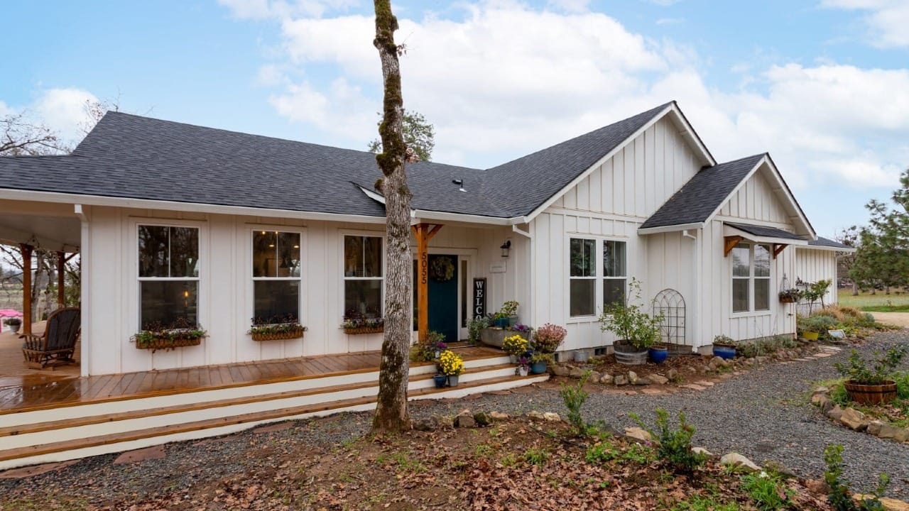 A white house with a wooden porch