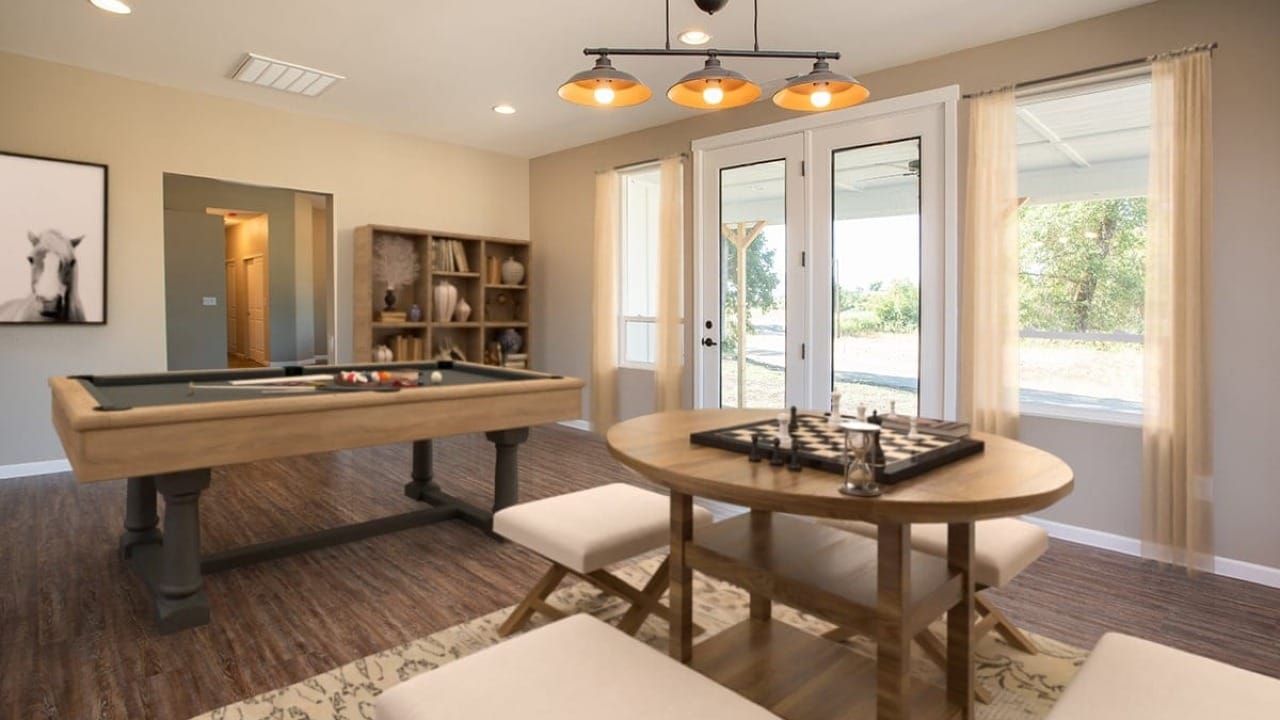 A game room featuring a pool table, round chess table with bench seating, built in shelving, and large windows letting in natural light.