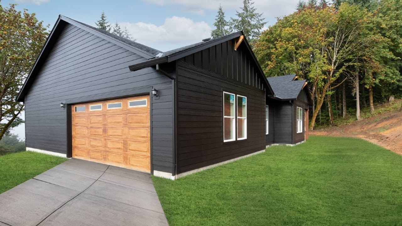 A black house with wooden doors
