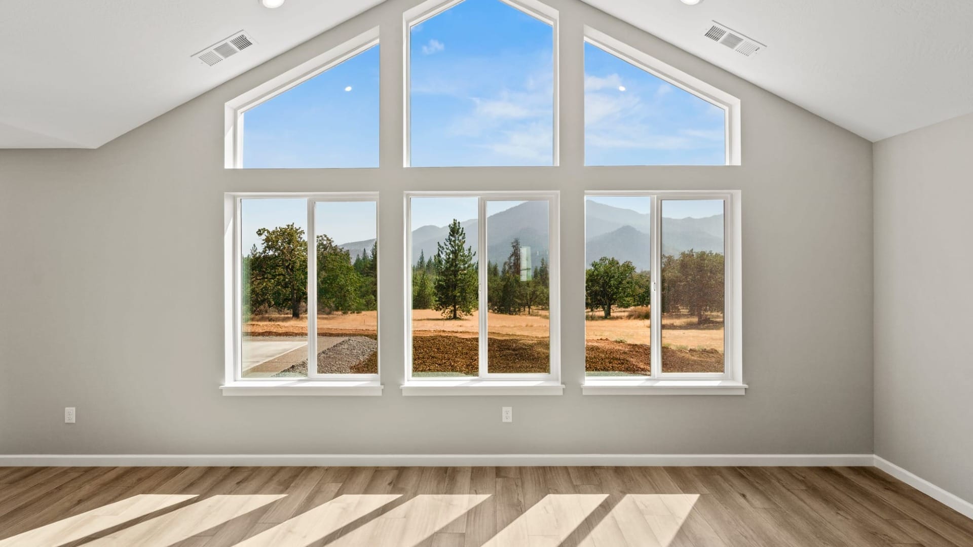 Windows looking outside to some mountains