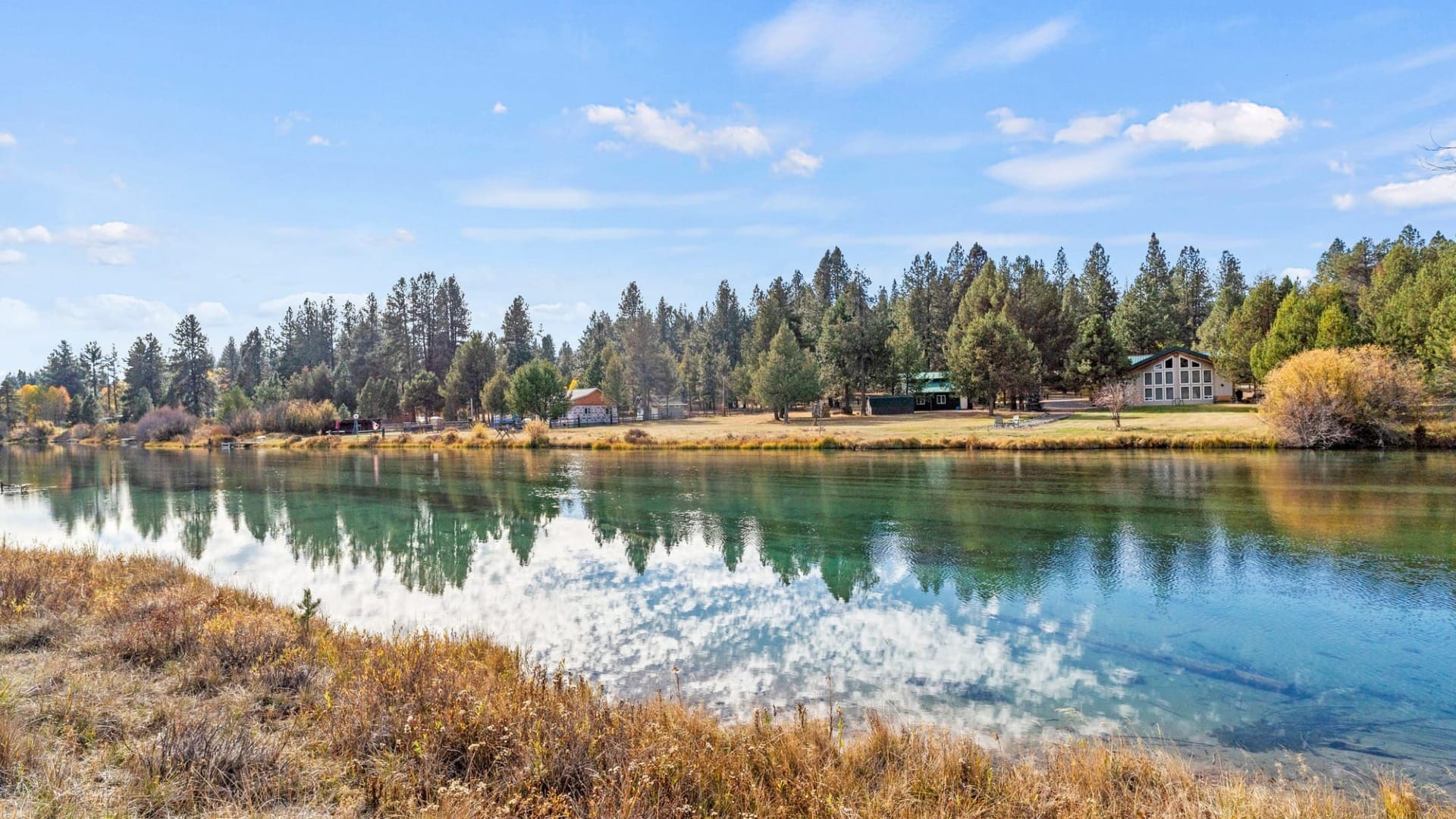 A river with a bunch of houses on the other side