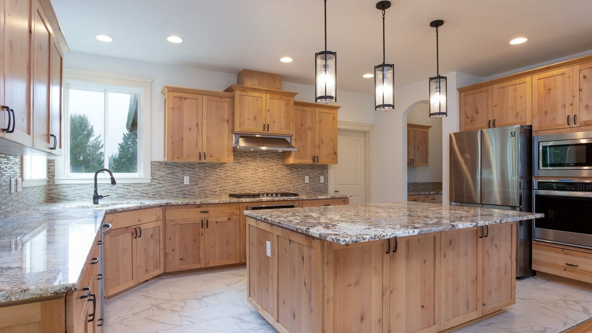 A kitchen with wooden cabinets