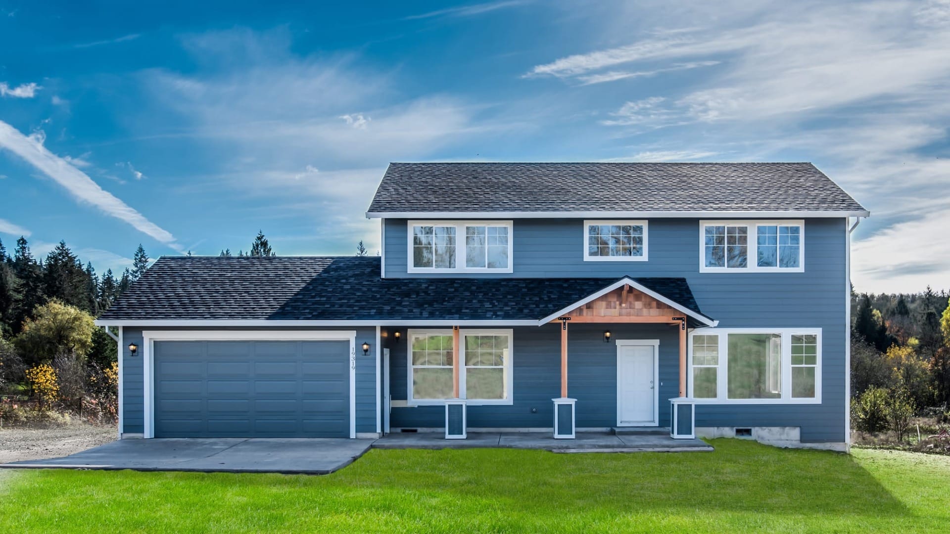 A blue house under a blue sky