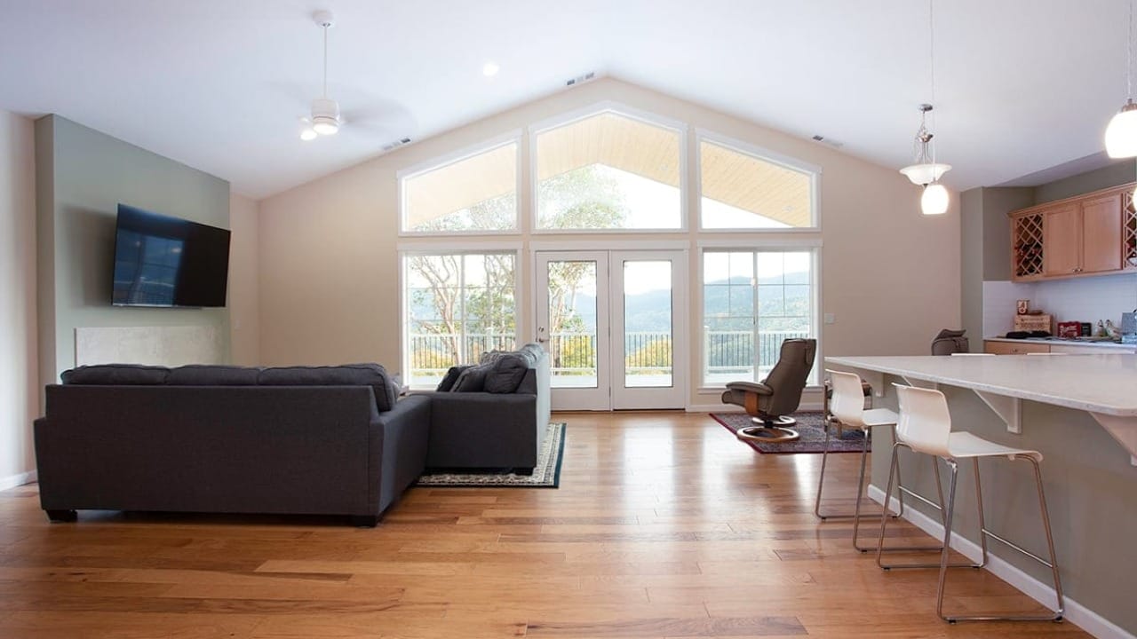 A living room with a kitchen next to it