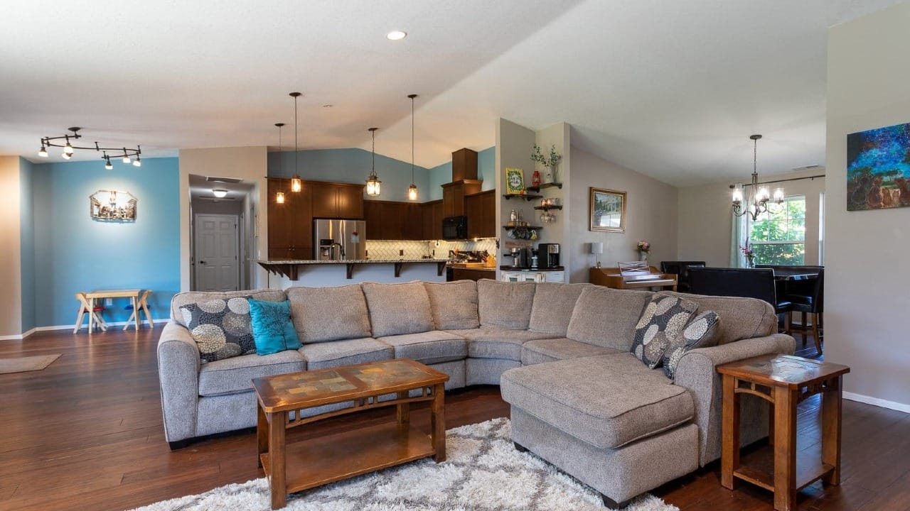 A living roo mwith hard wood flooring