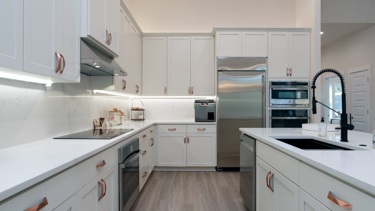 A kitchen white cupboards