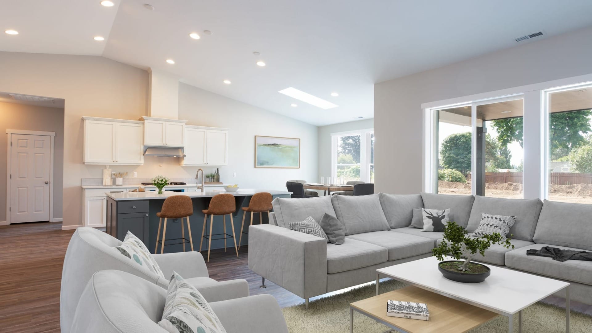 A living room with a bunch of seating inside a custom home
