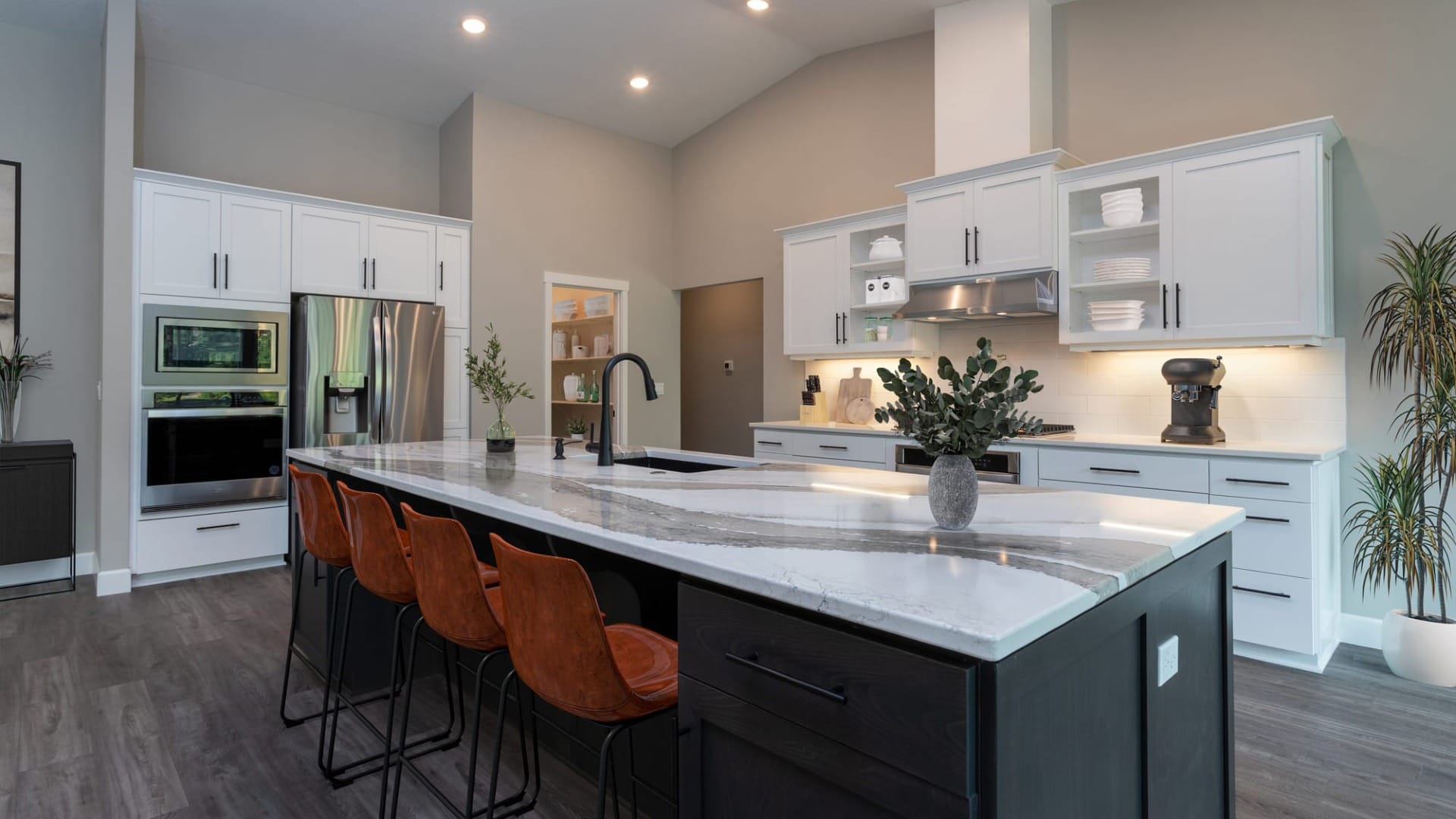 A kitchen island with a bunch of spots to sit
