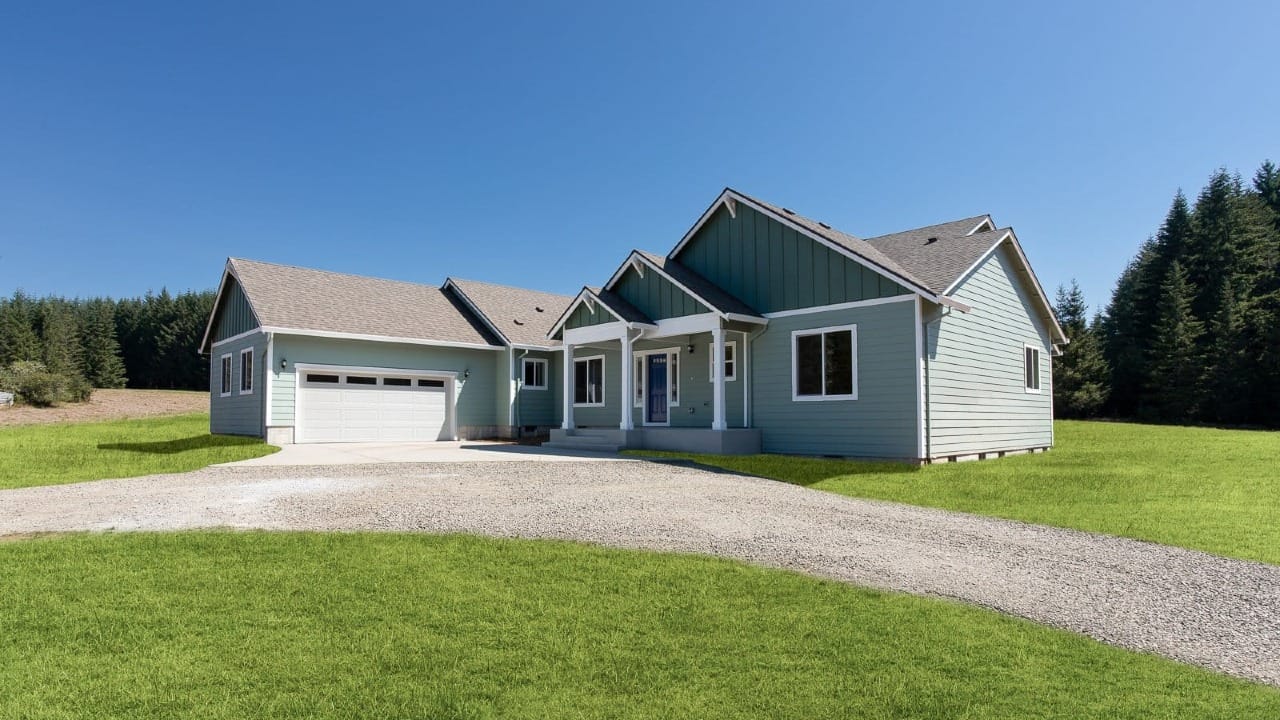 A blue house in a field