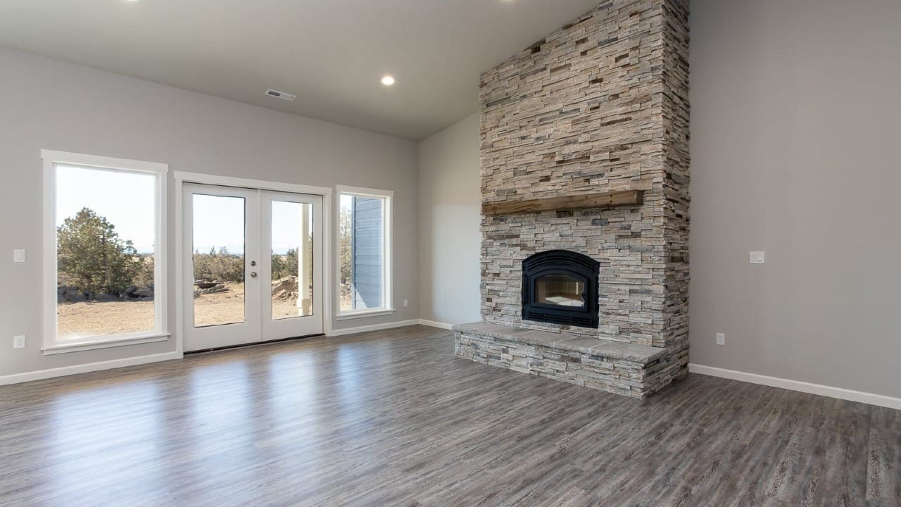 An empty room with a fireplace