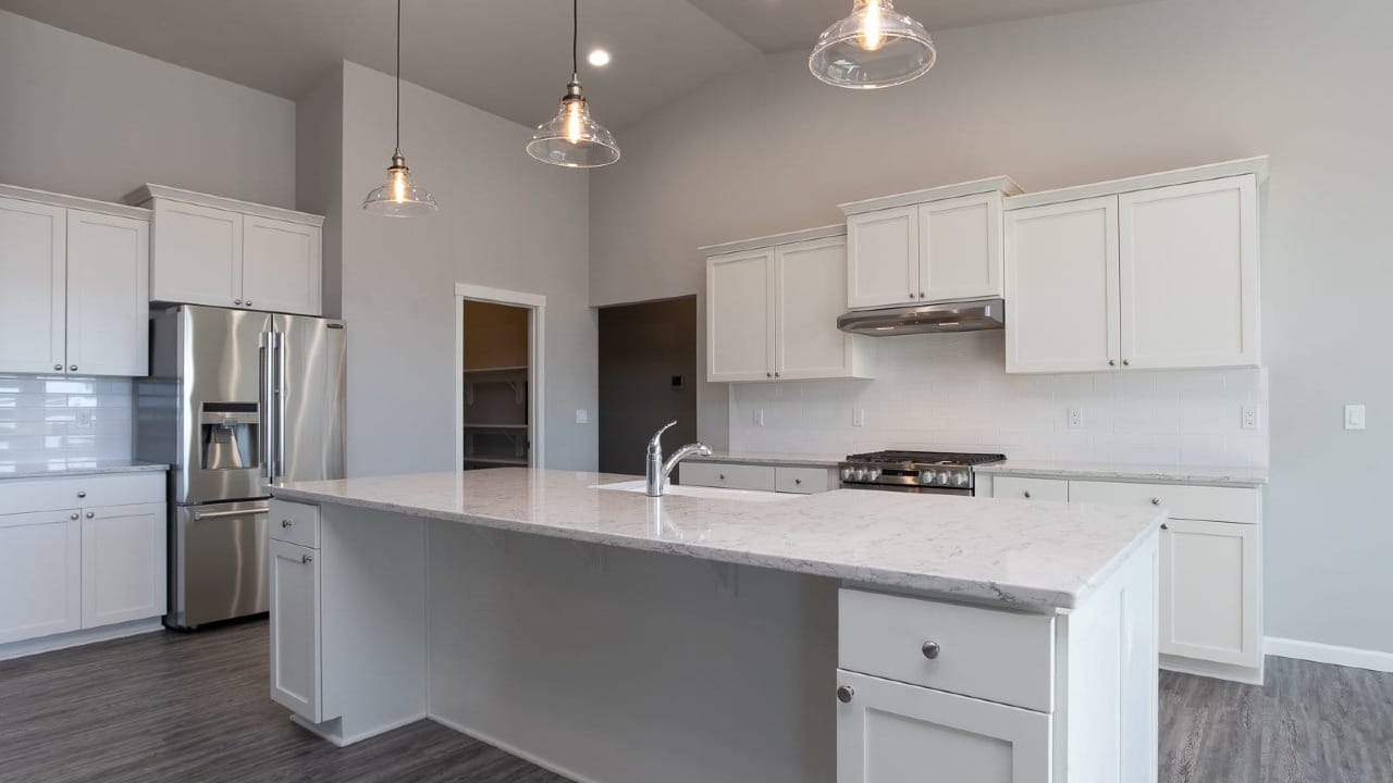 A white kitchen that doesn't have any decorations