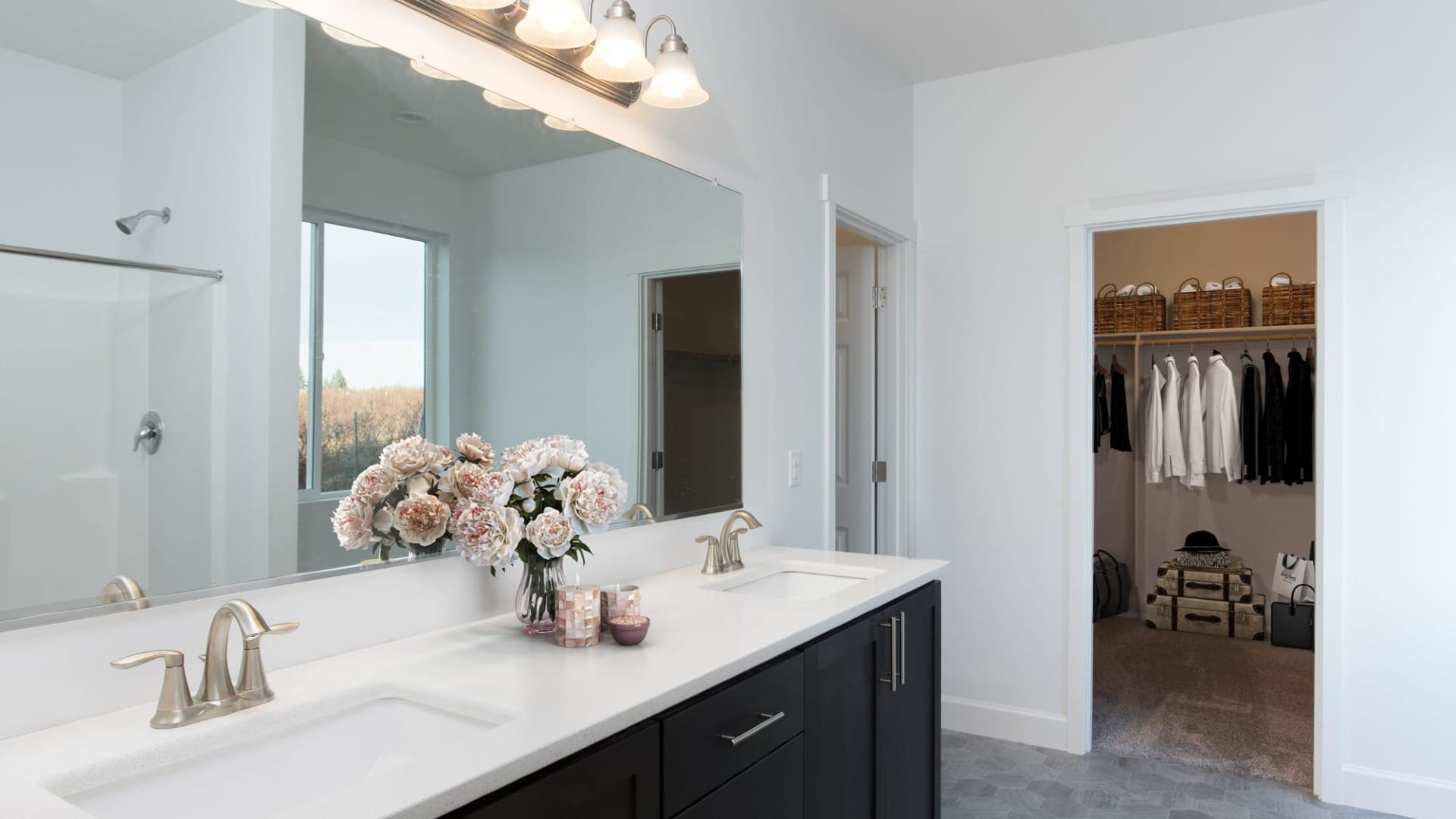 A bathroom with a walk-in closet opened in the olympus plan