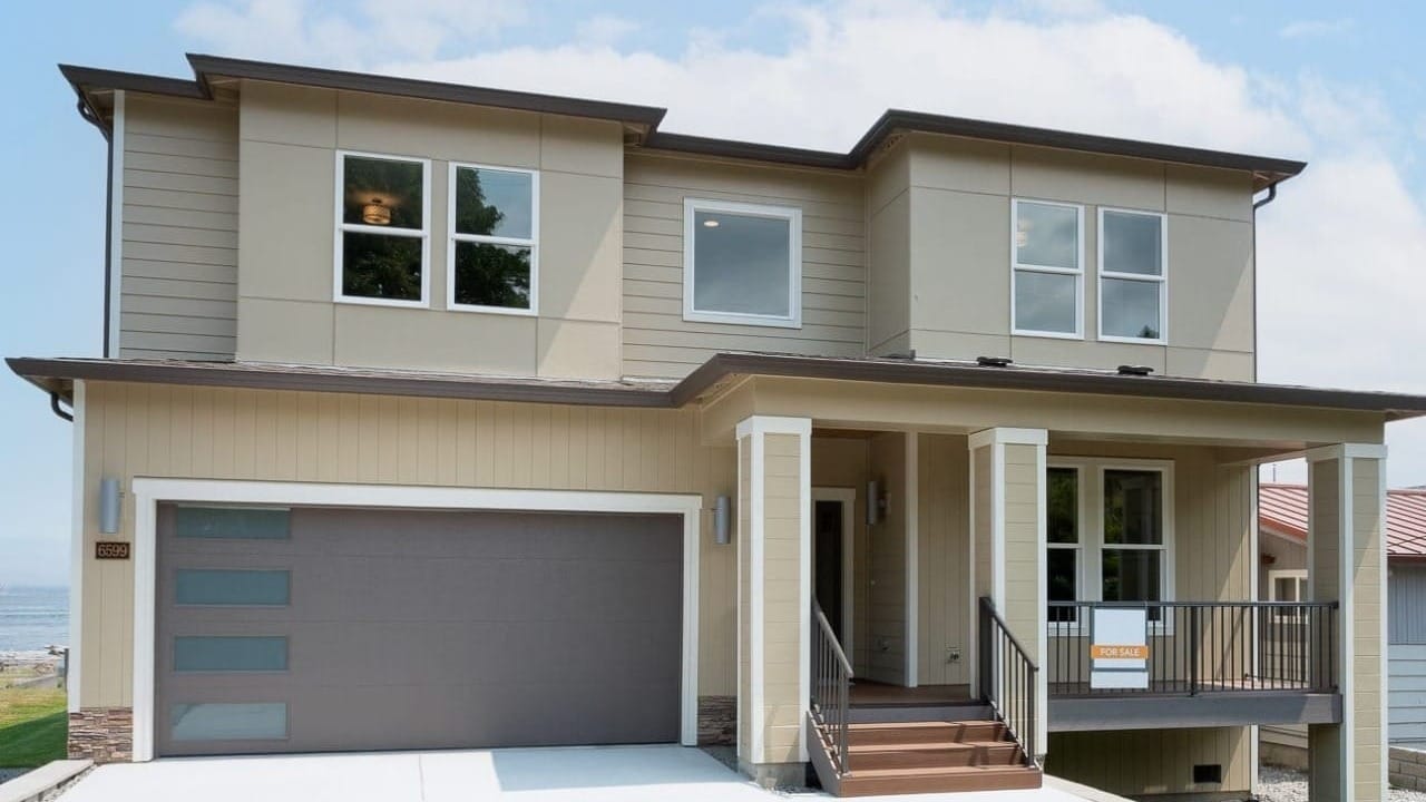 A two-story house that is tan