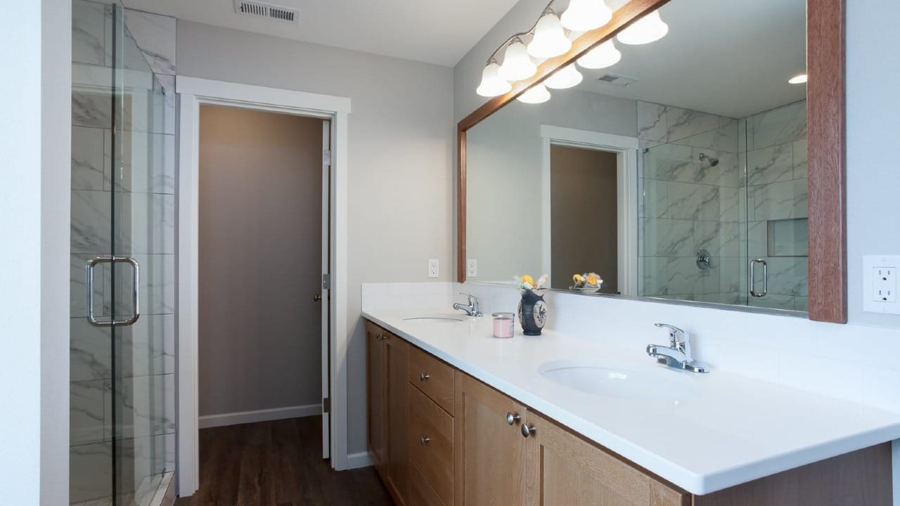 A bathroom with a large mirror