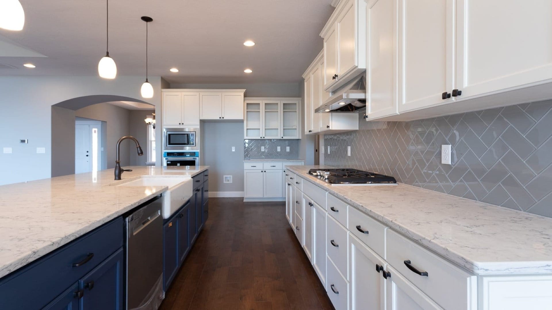 Newly renevated kitchen, with white, gray, and blue accents