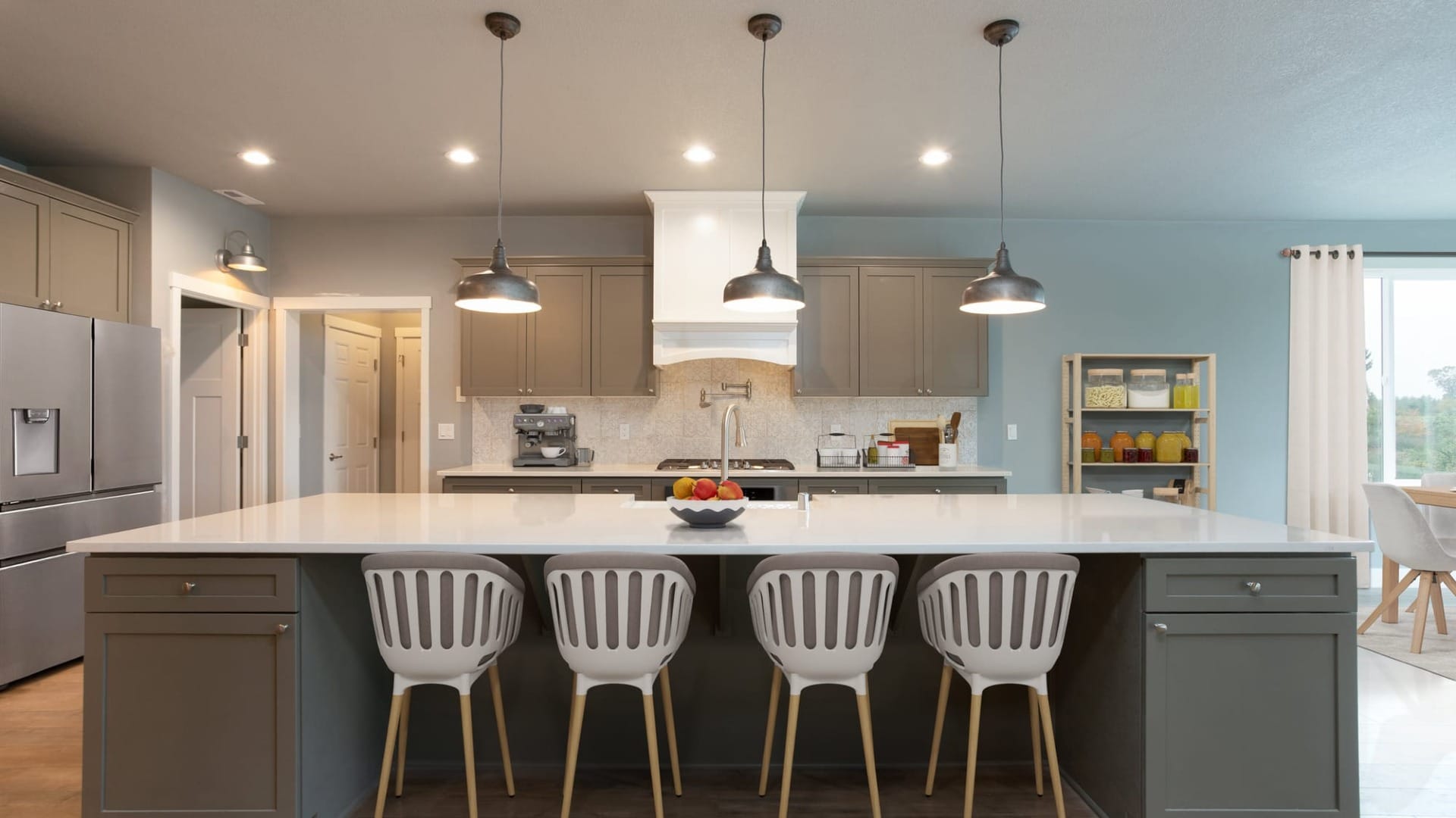 A modern kitchen with colorful cupboards