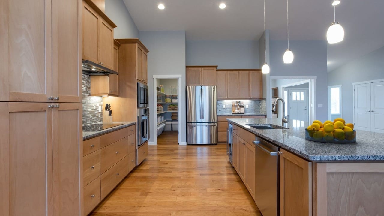 A kitchen with brown cupboards