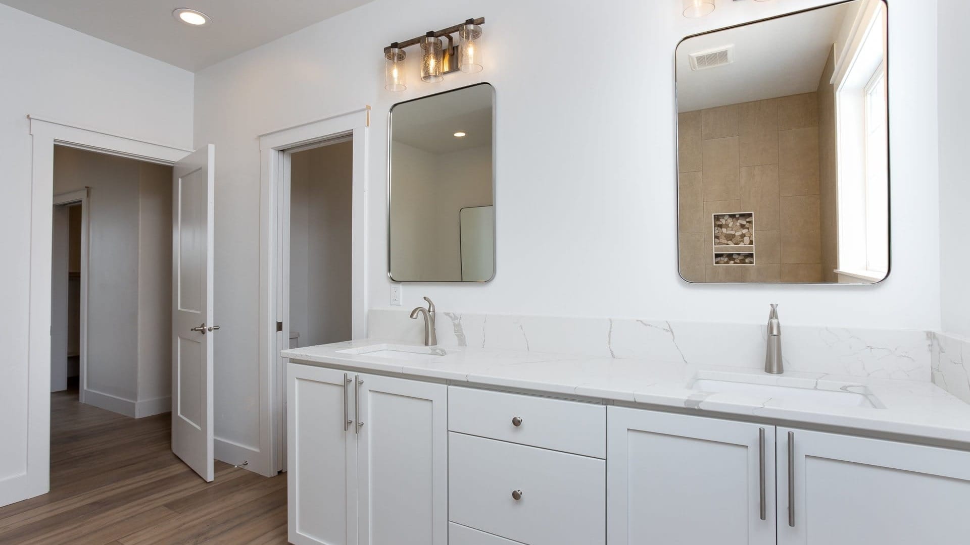 A bathroom sink with mirrors