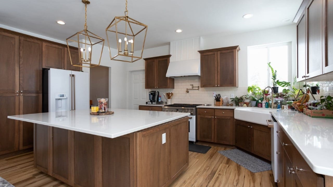 A kitchen with wooden cupboards in a custom house