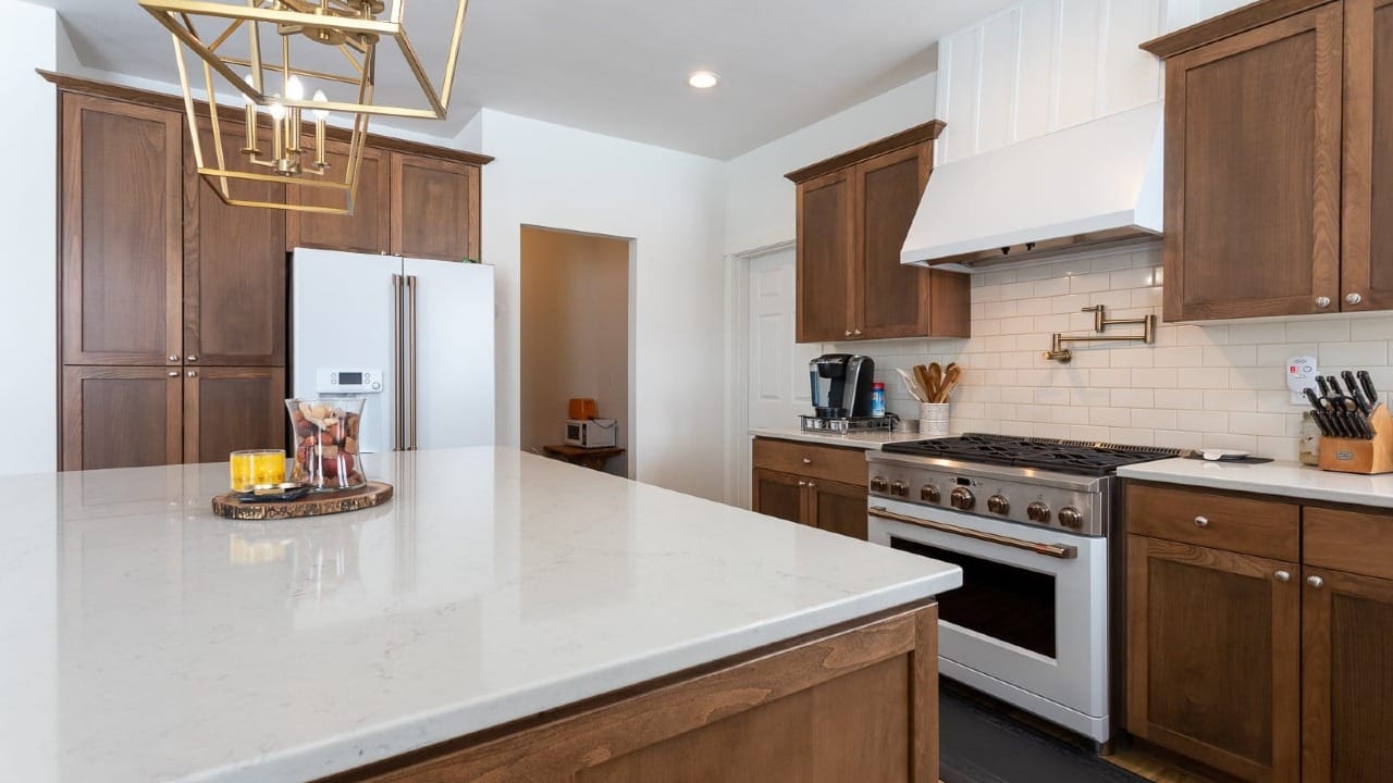 A kitchen with wooden cupboards