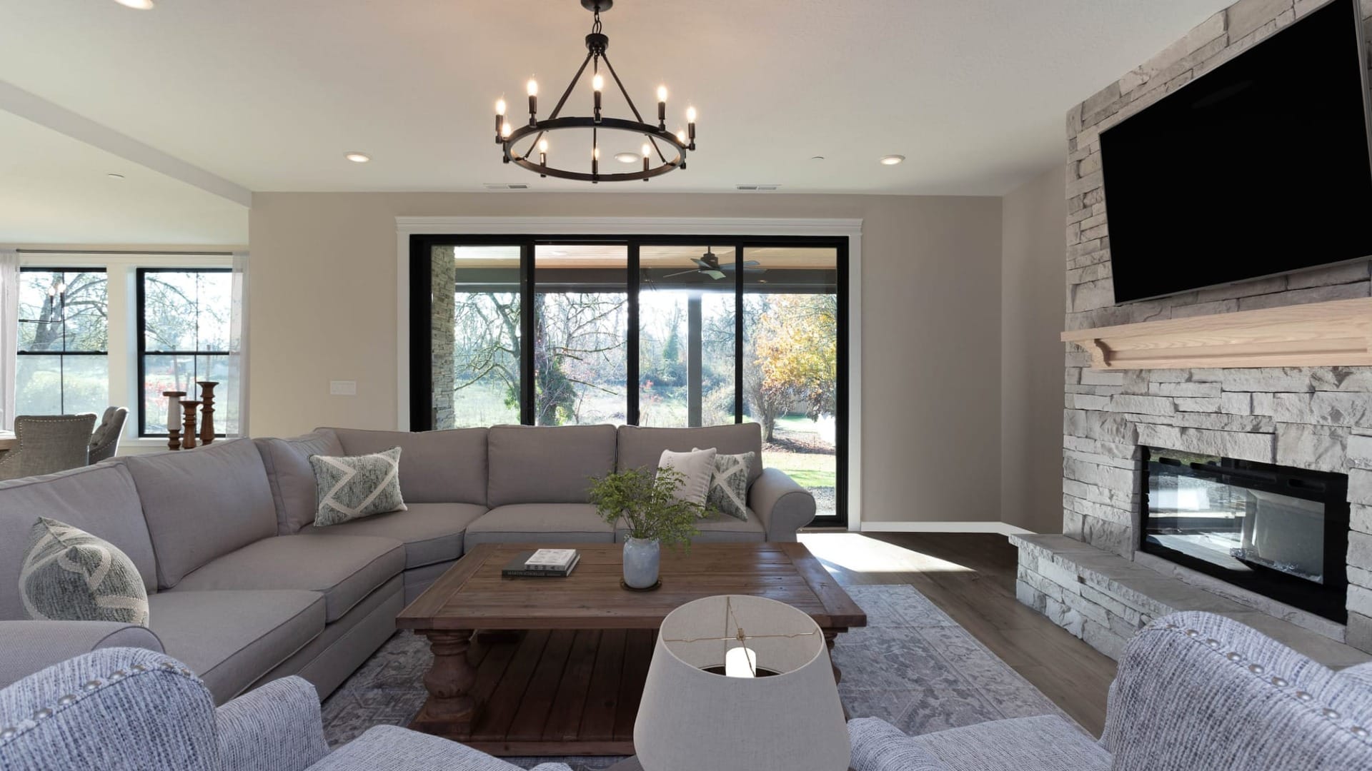 A living room with a TV on the wall