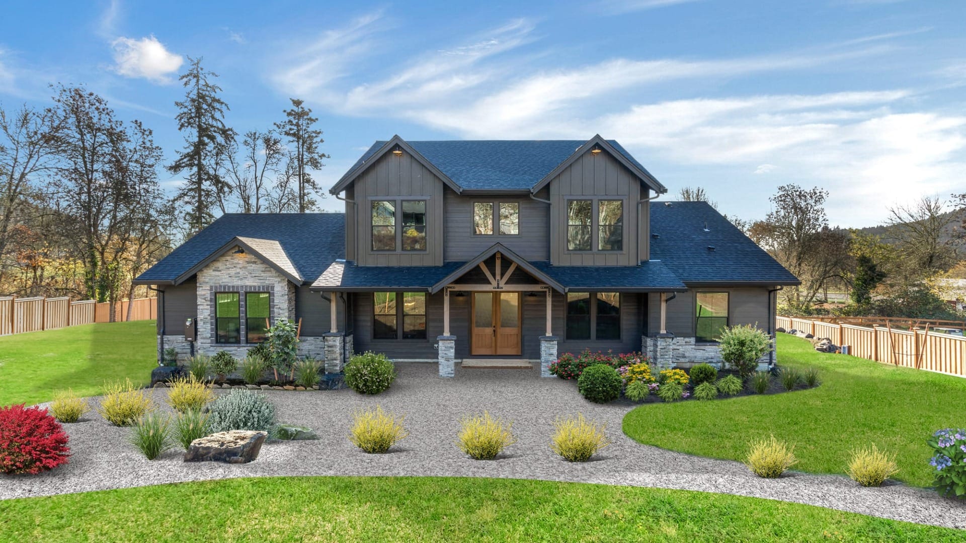 A two-story house that has dark grey paint on it