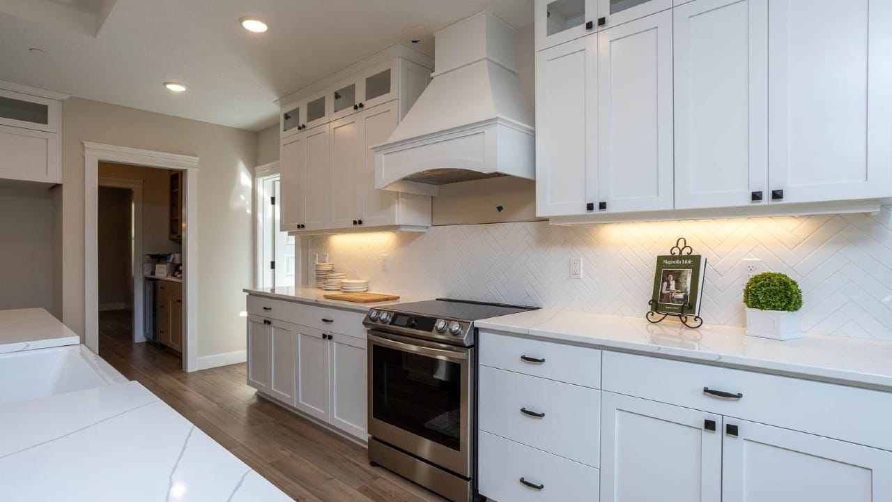 A kitchen with a ton of white cabinets