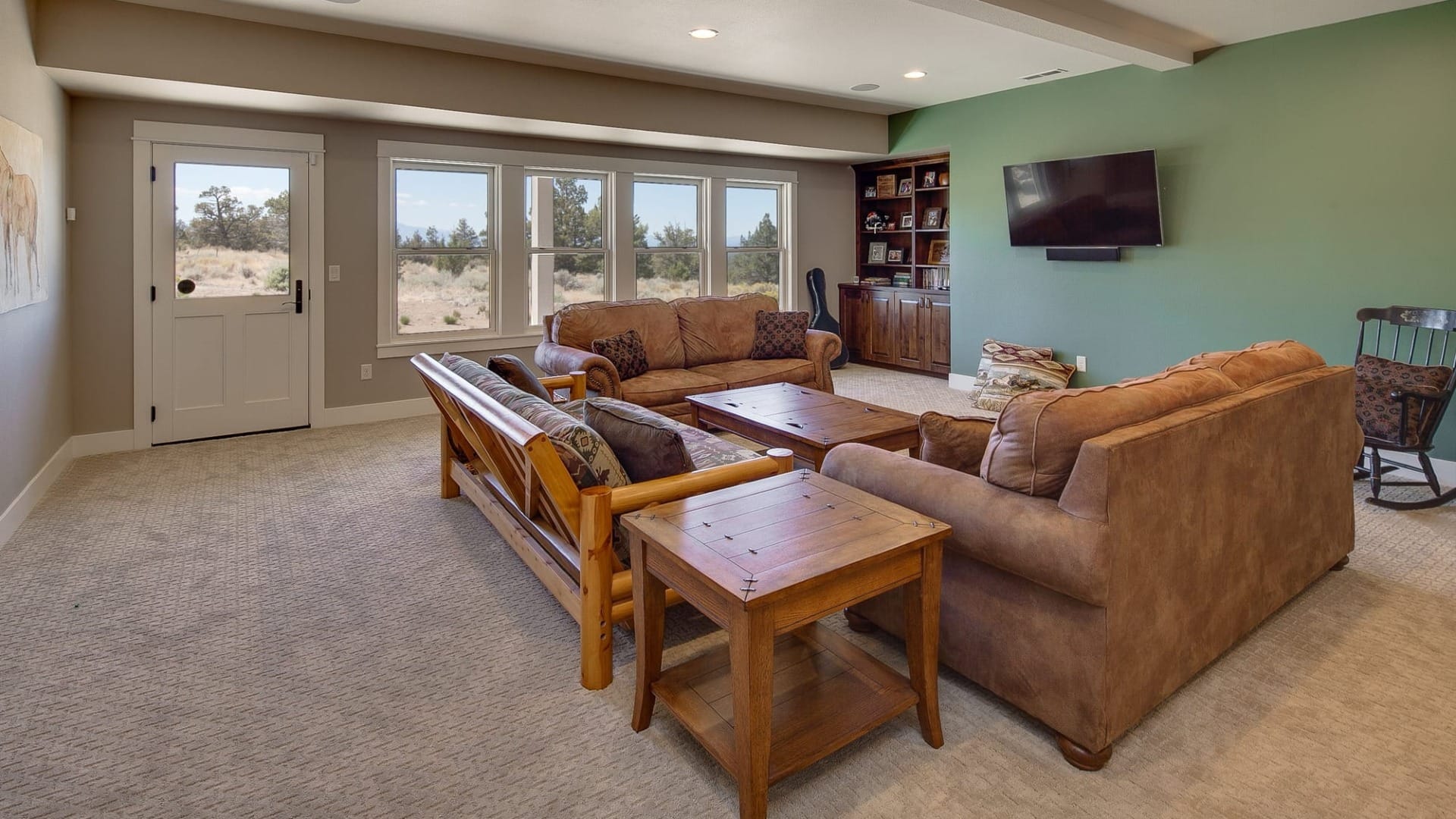 A living room with a bunch of couches