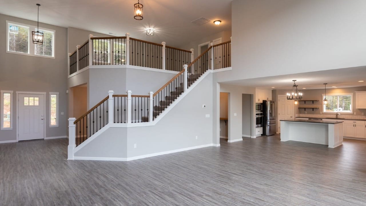 A massive room with a staircase leading up to the second floor