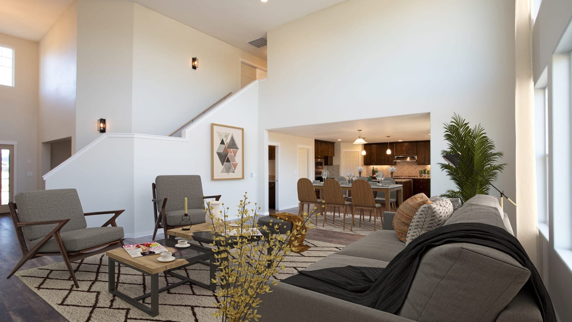 A living room looking into a kitchen with fall decorations in both rooms