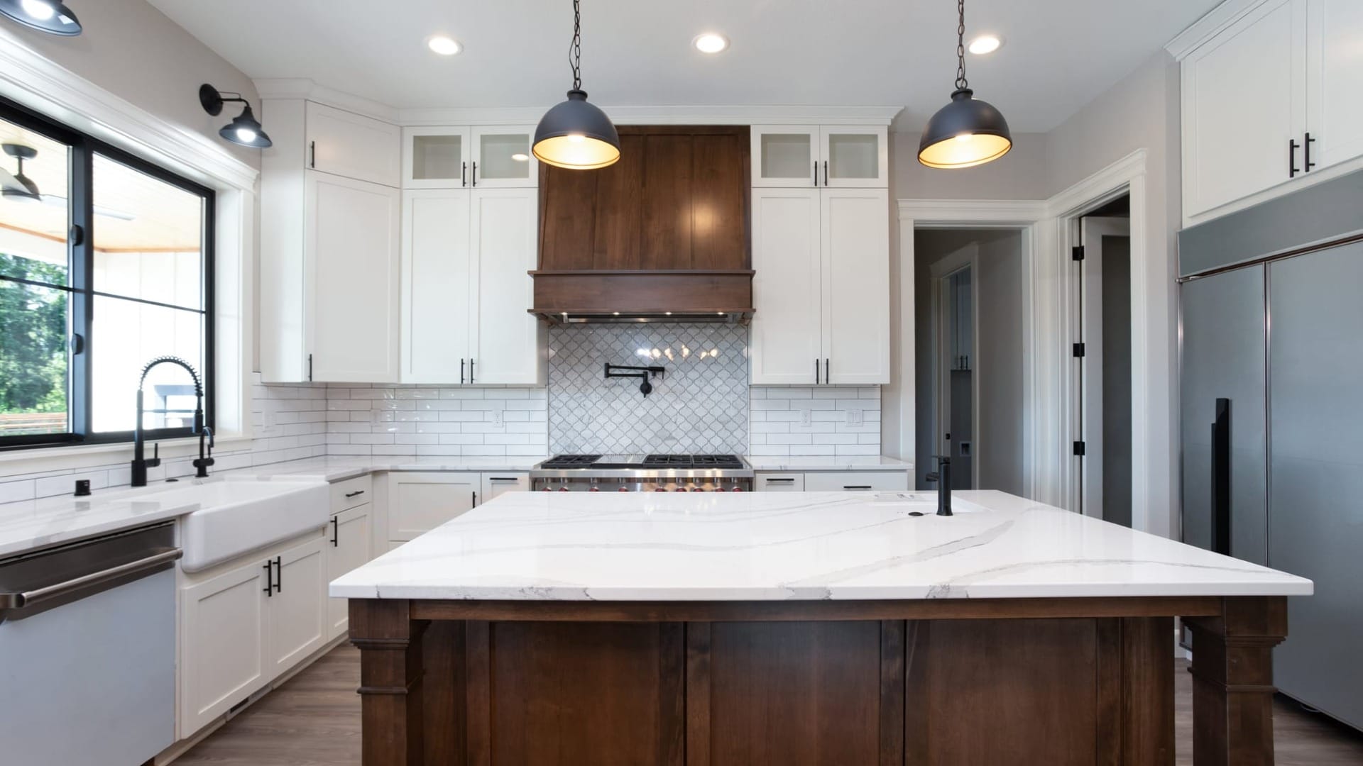 A kitchen with wooden cabinets
