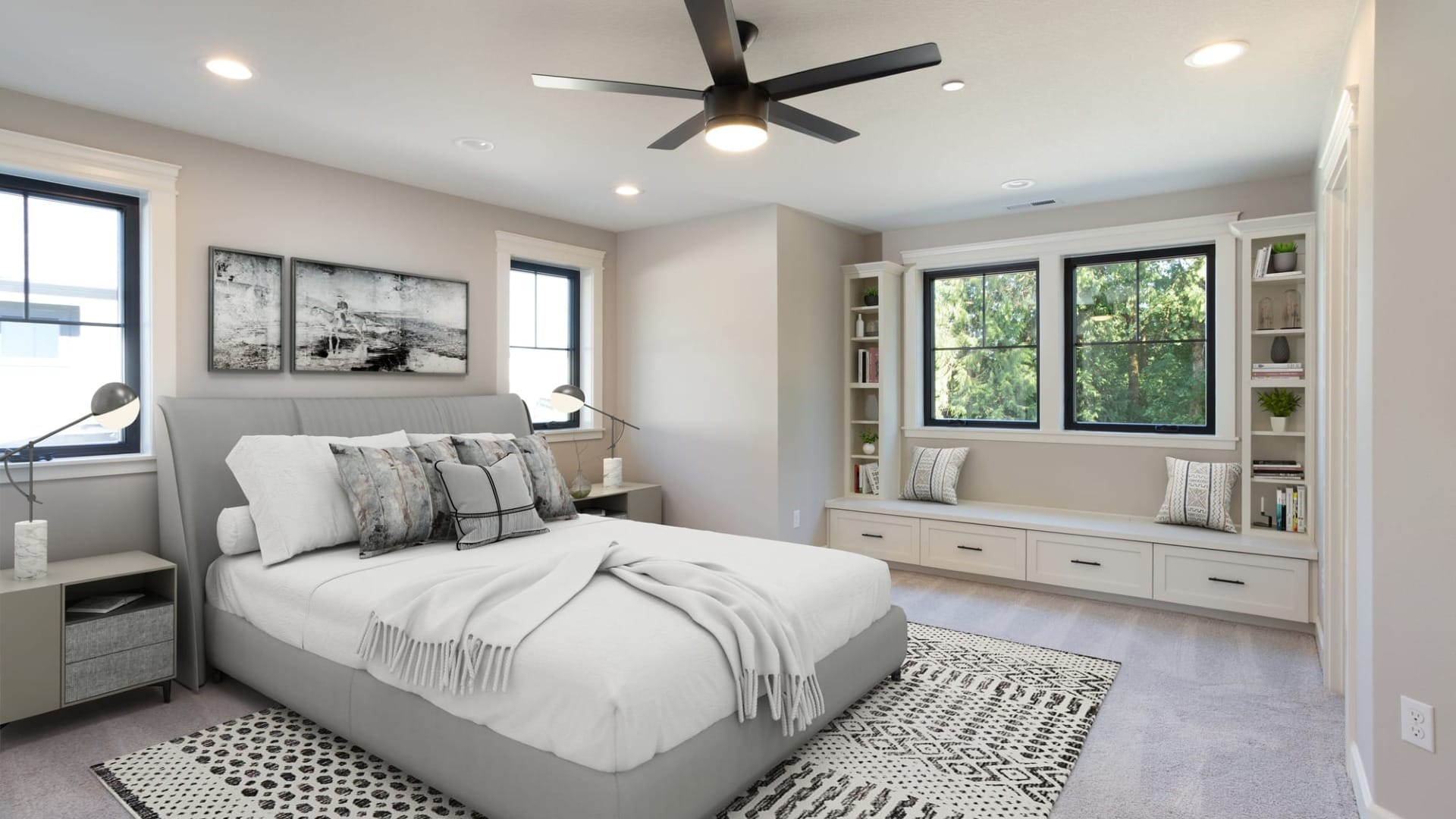 A master bedroom with a ceiling fan above the bed