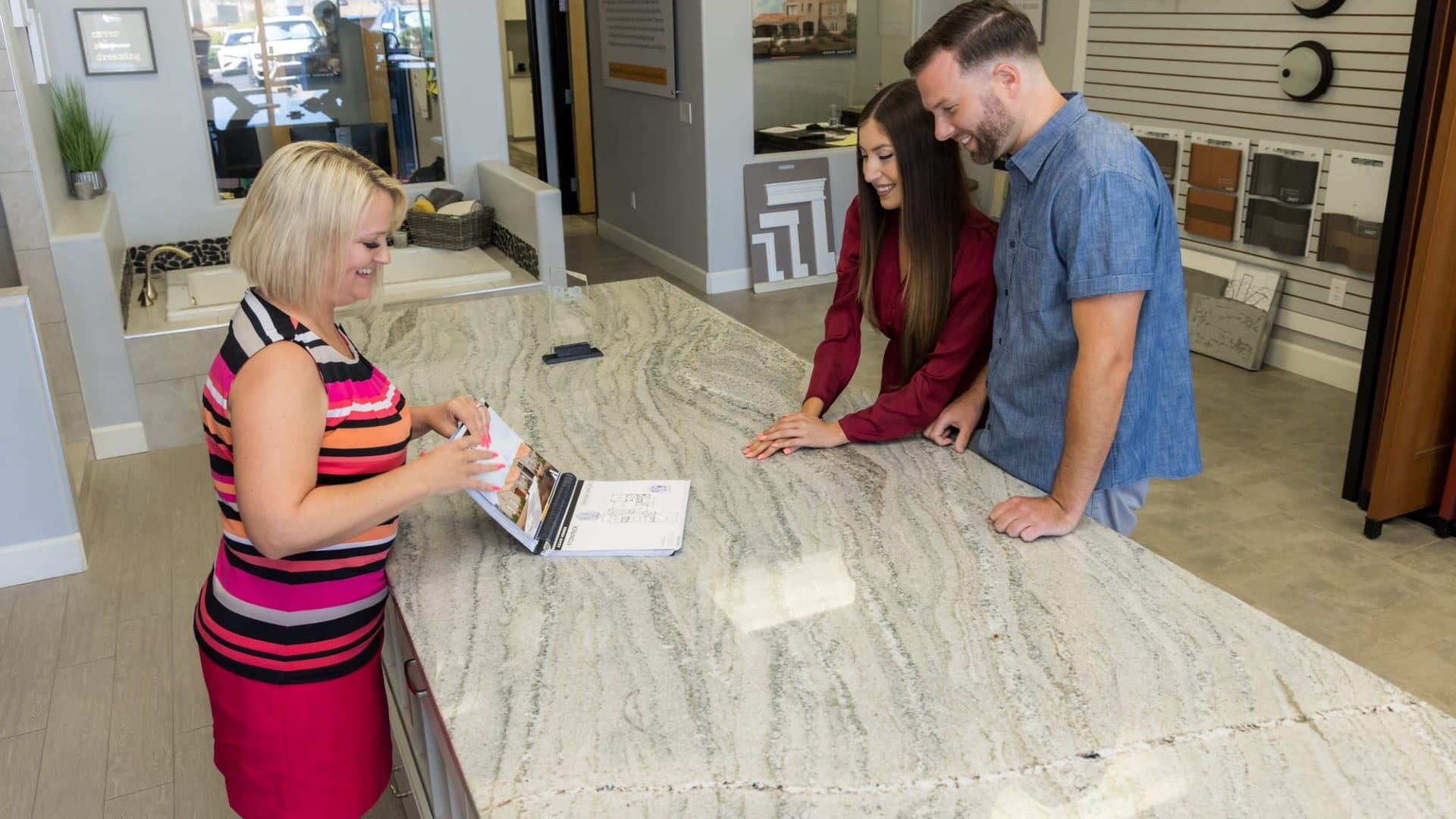 A lady showing some templates to customers