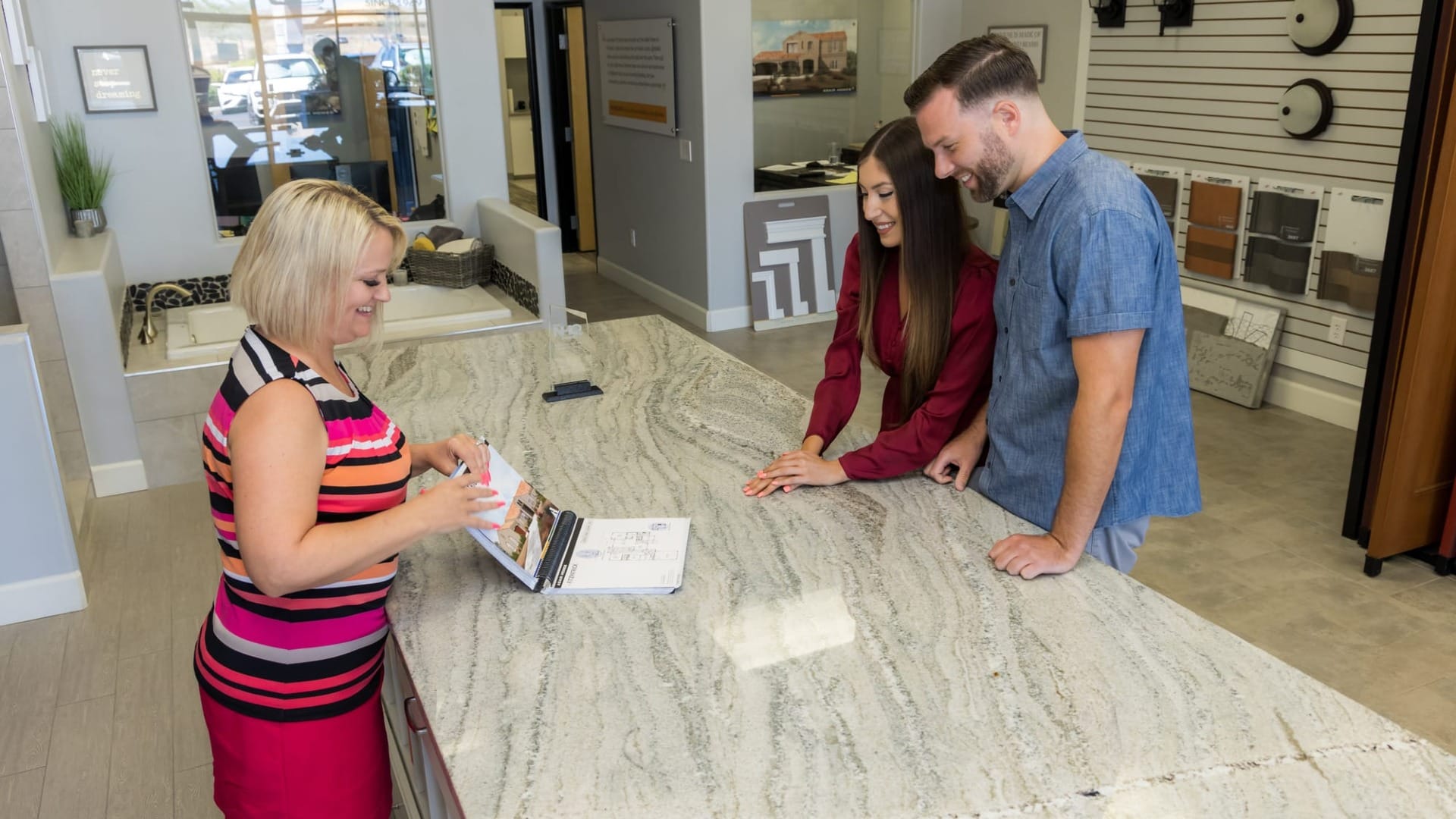 A couple looking at a booklet for their new home