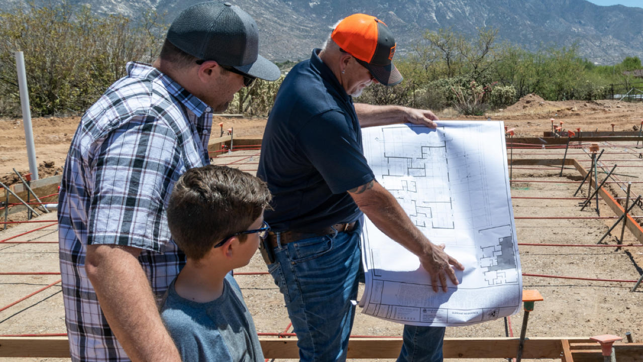 Client looking at the blueprint of their new home