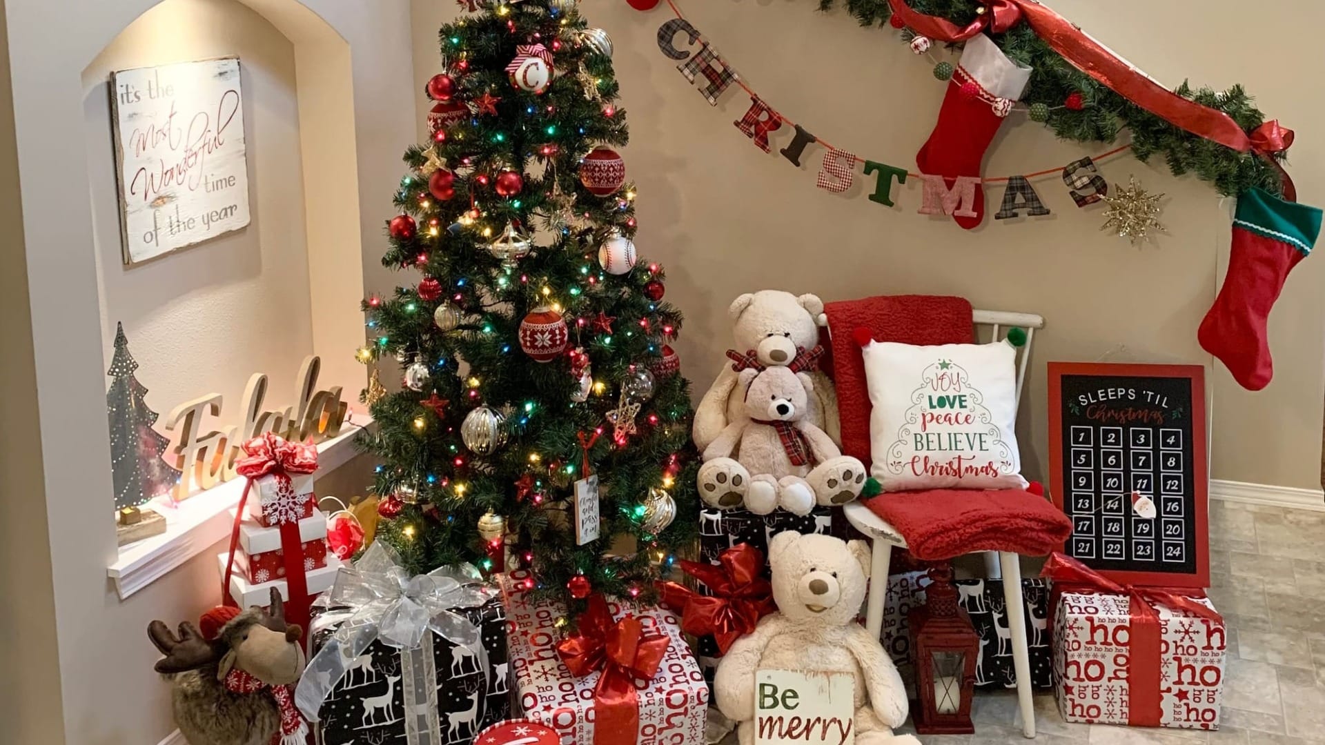 A corner with a ton of christmas decorations in it