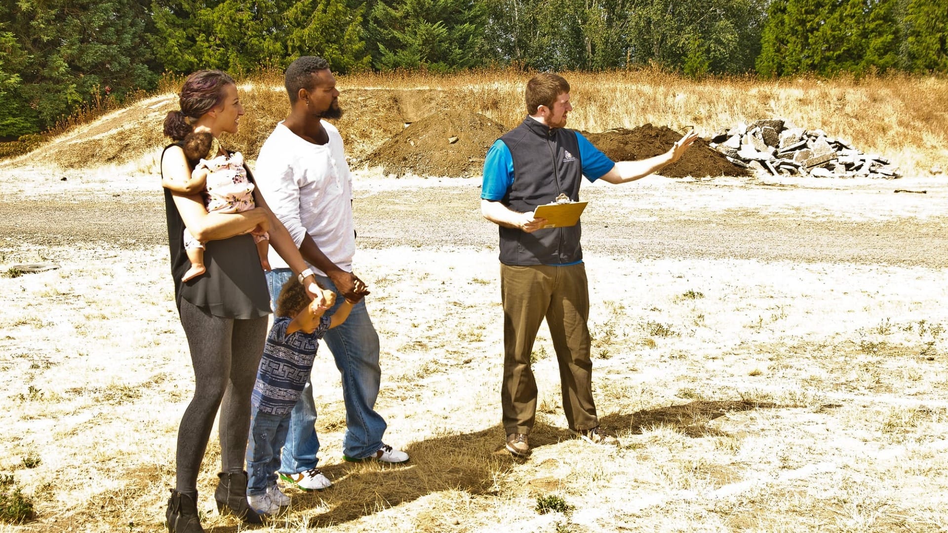 A couple looking at a lot where their house will be built