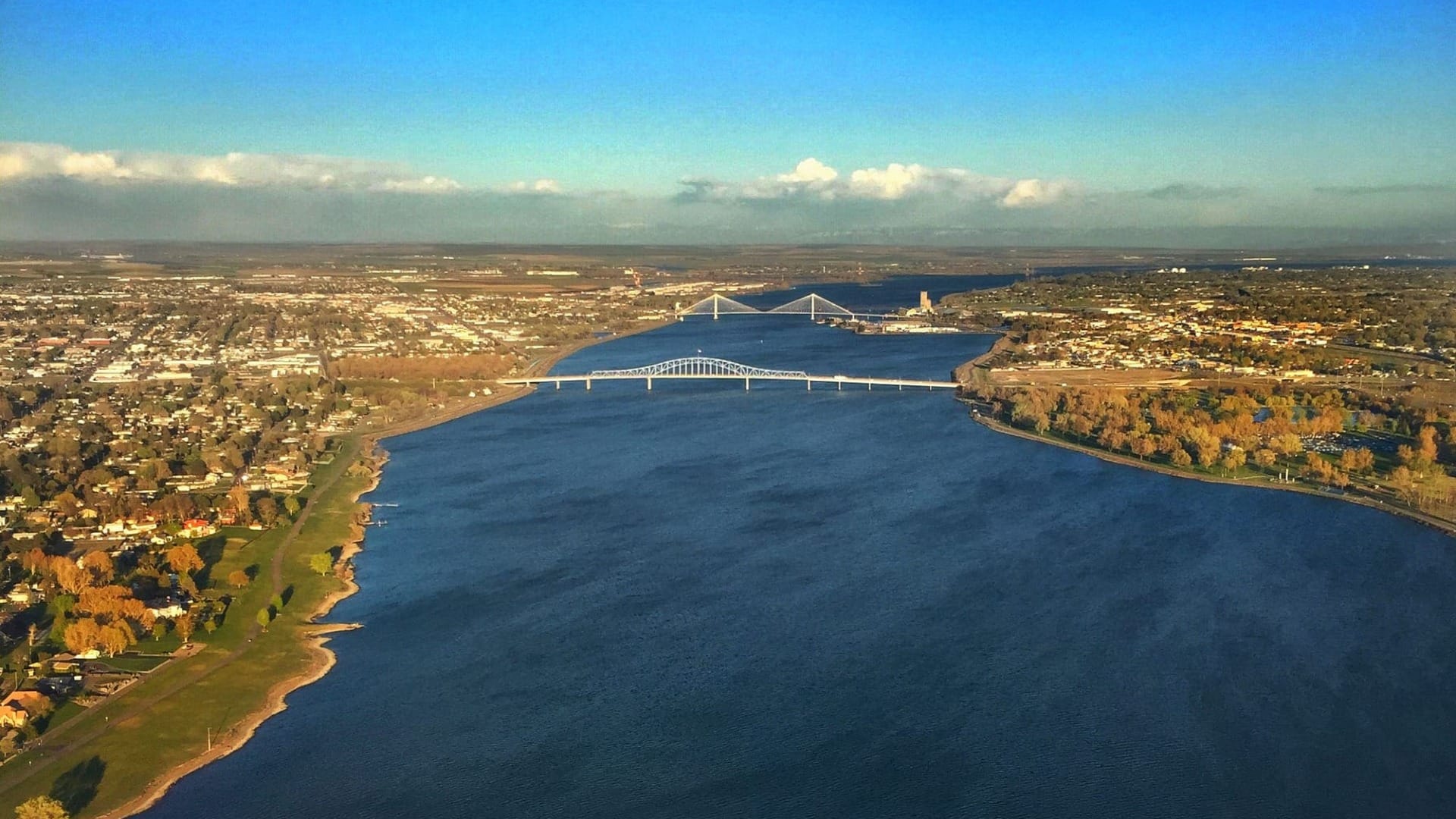 An above view of a river with multiple bridges spanning across it