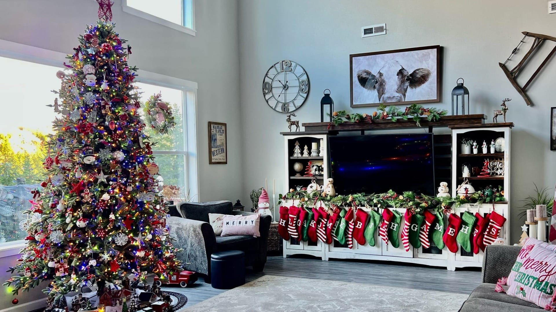 A large living room with a bunch of christmas decorations