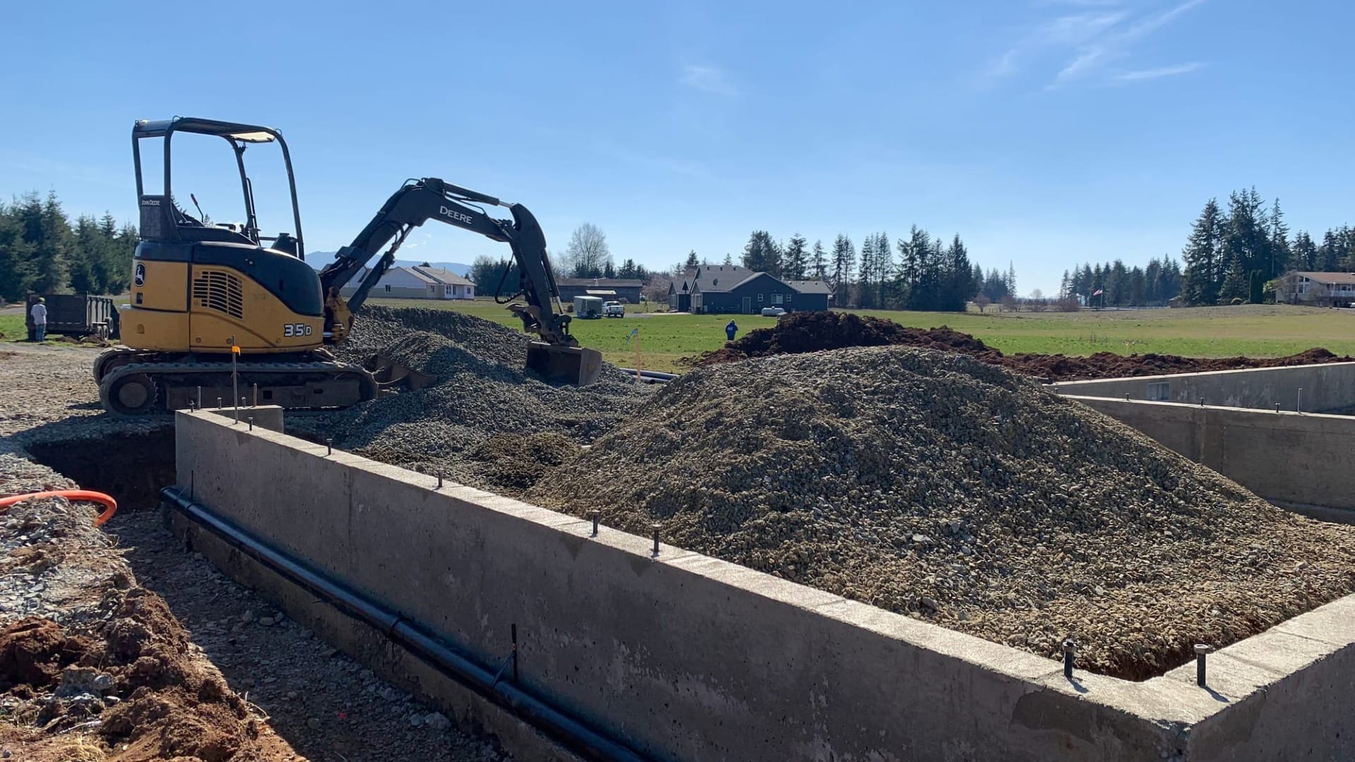 An excavator digging out a building foundation