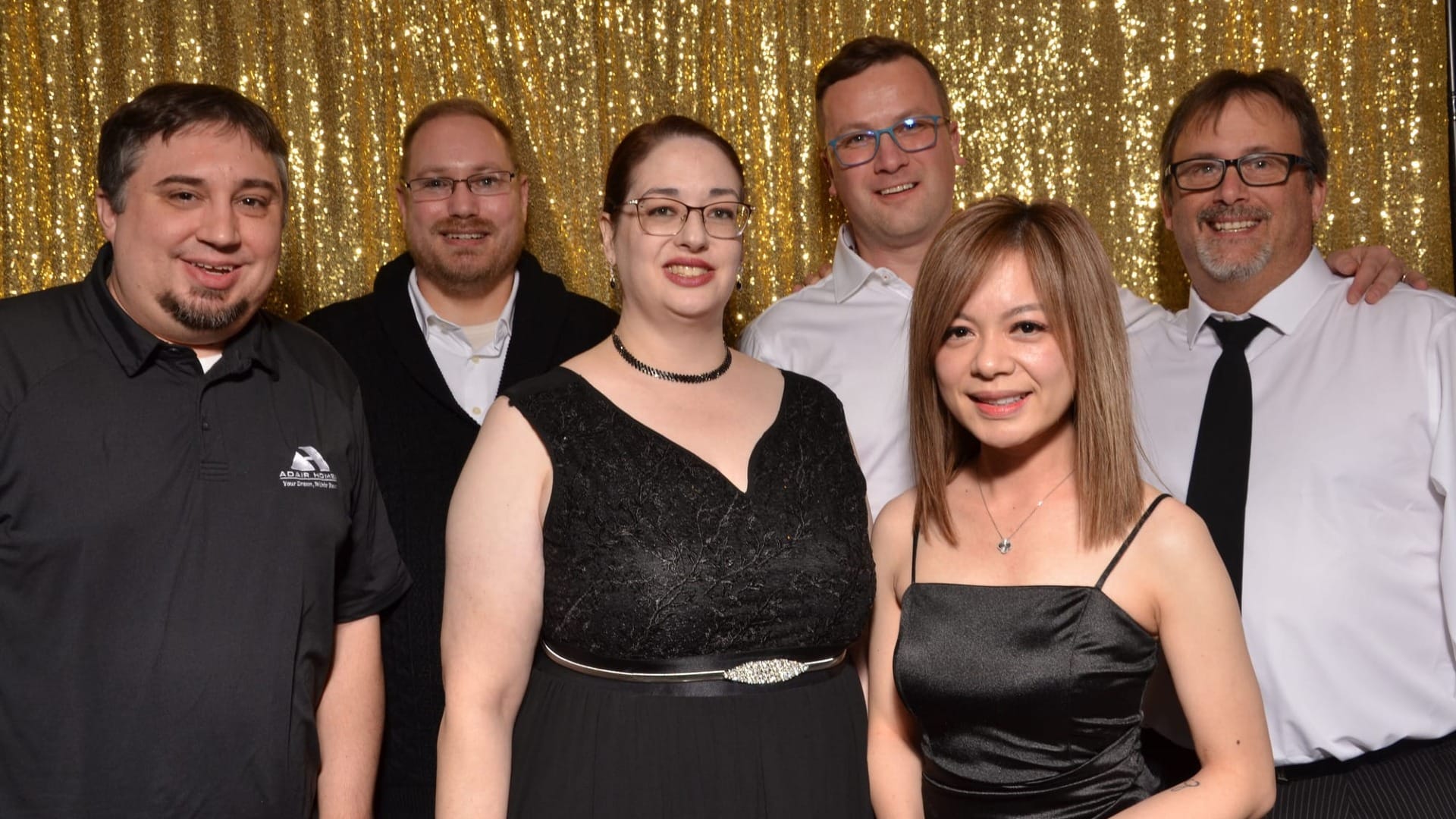 Team members of the Adair Home Family at a party