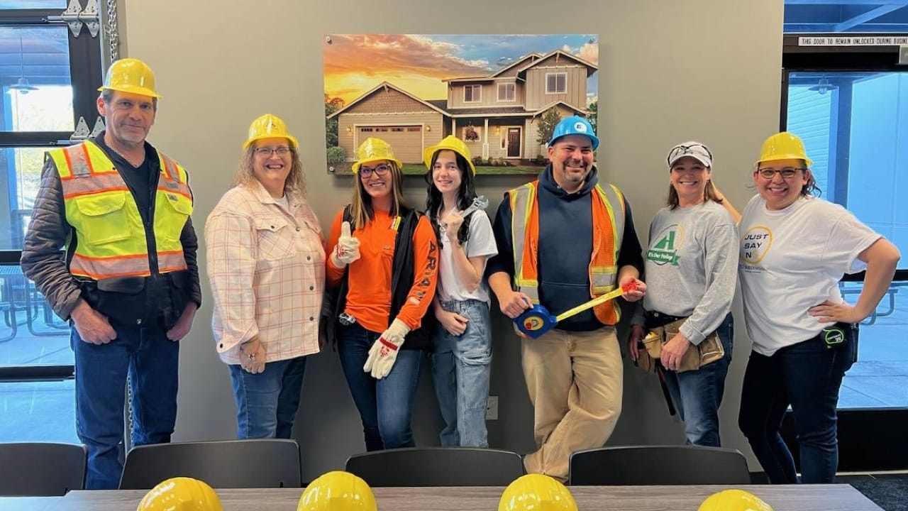 People getting ready to go check out a house being built