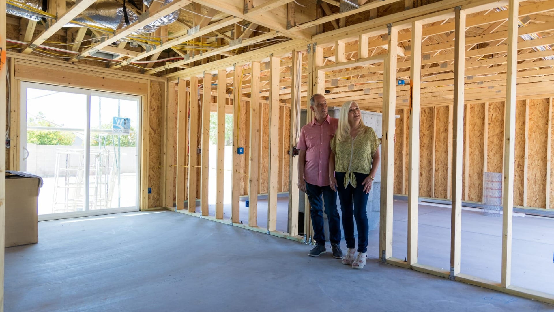 Couple looking at empty room