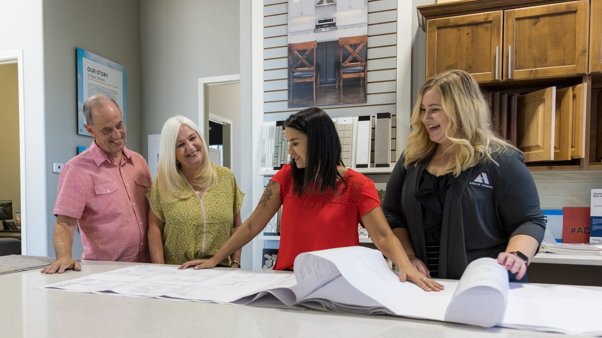 A couple looking at blueprints for a house