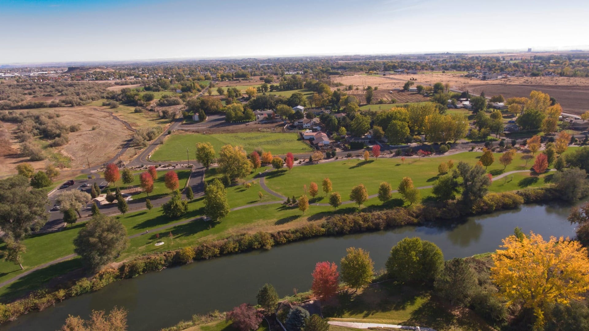 A river moving through a location with a ton of trees
