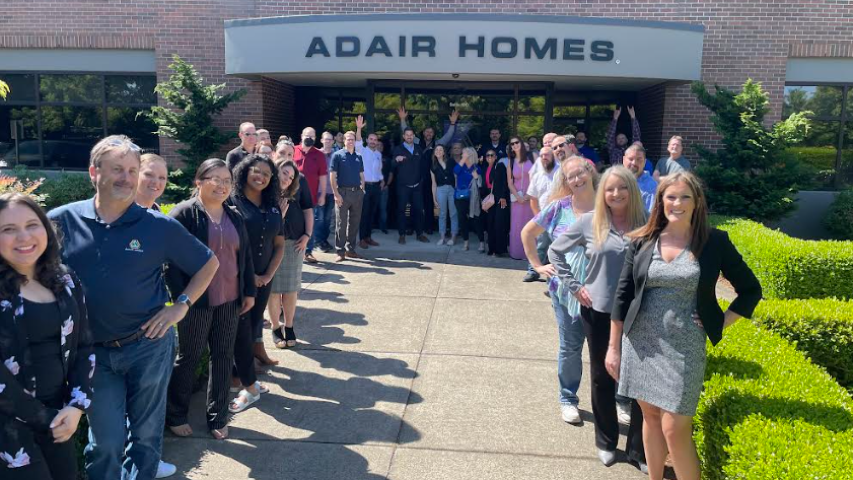 Adair homes team standing outside thier office