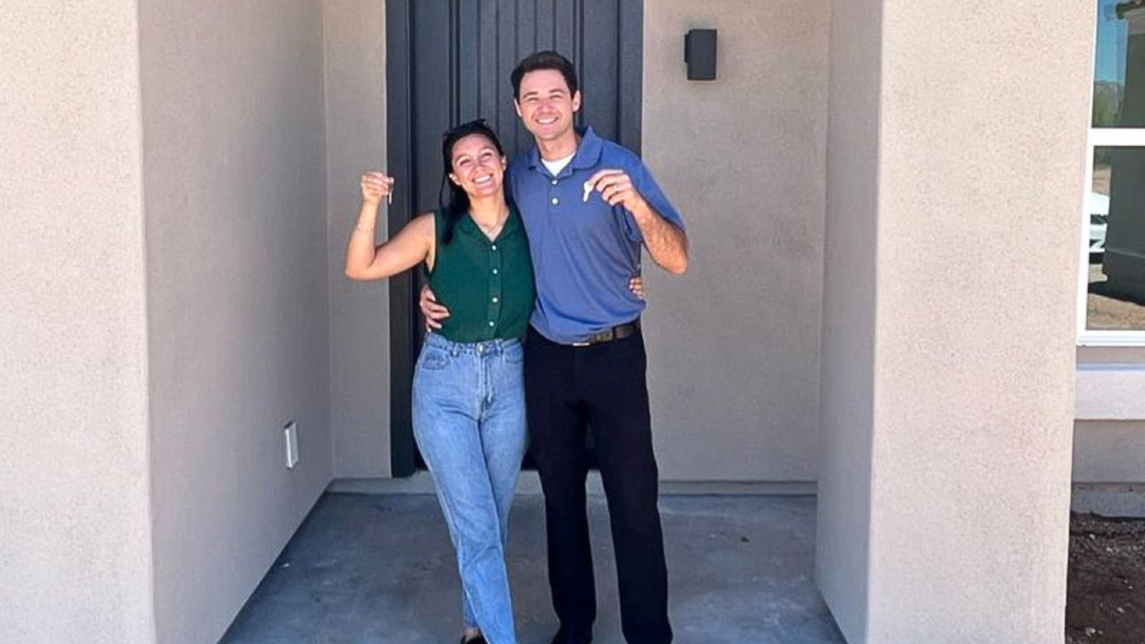 A couple that is holding a key to their now home