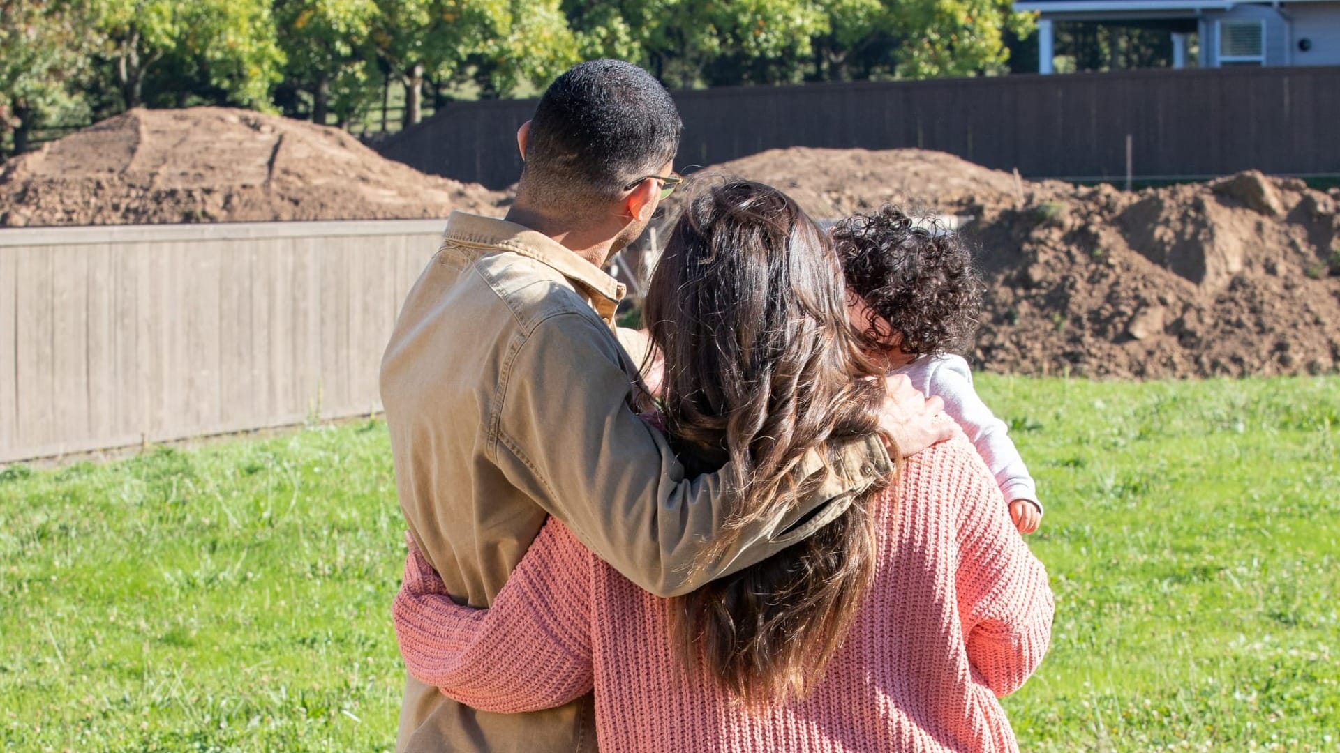 A family looking at a plot of land