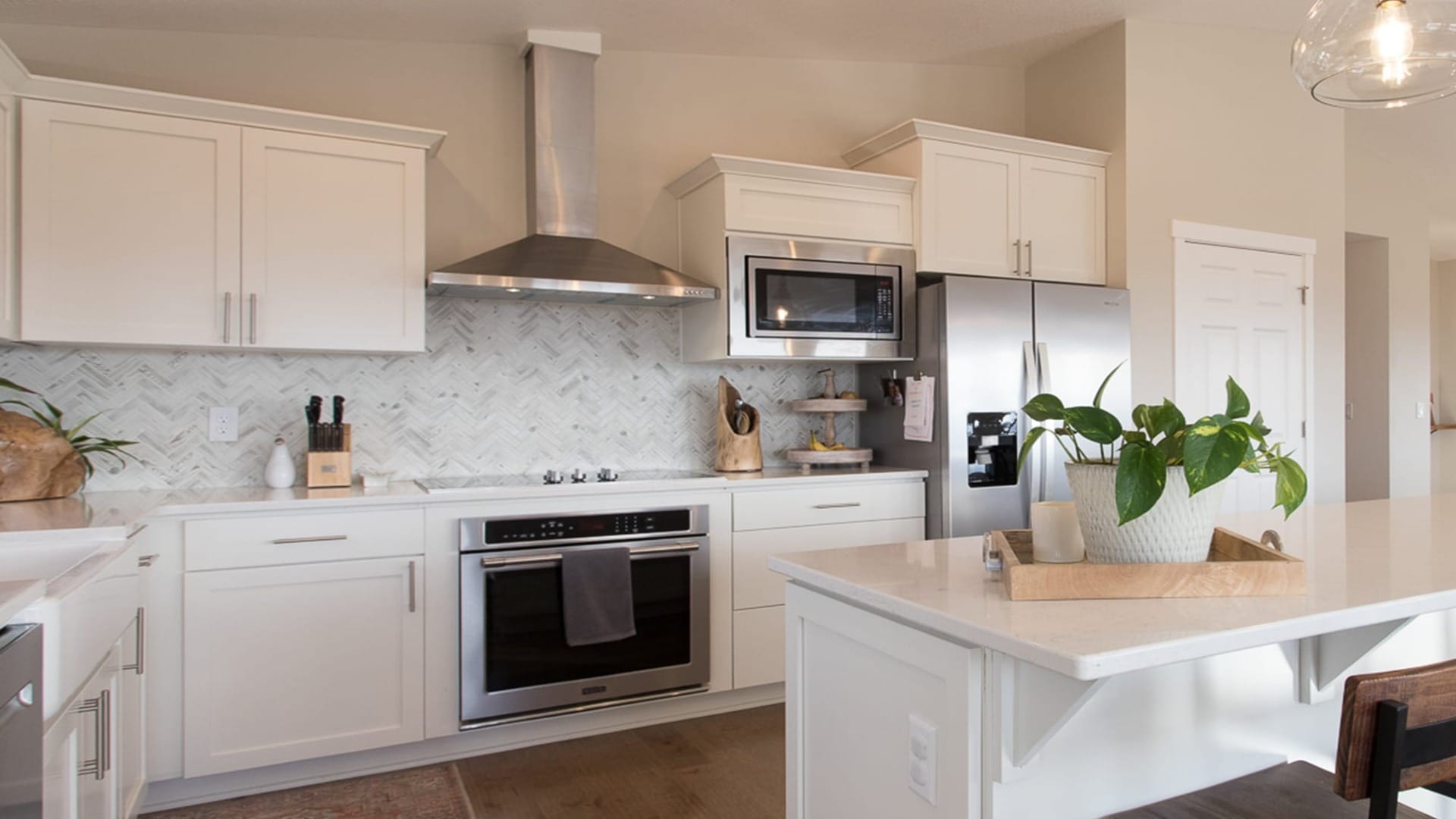 A kitchen with white cupboards