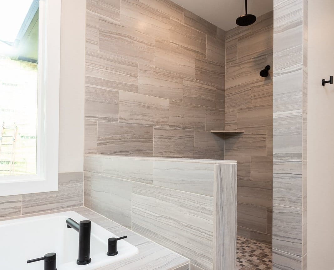 Master bathroom close up of the modern style shower and bath tub